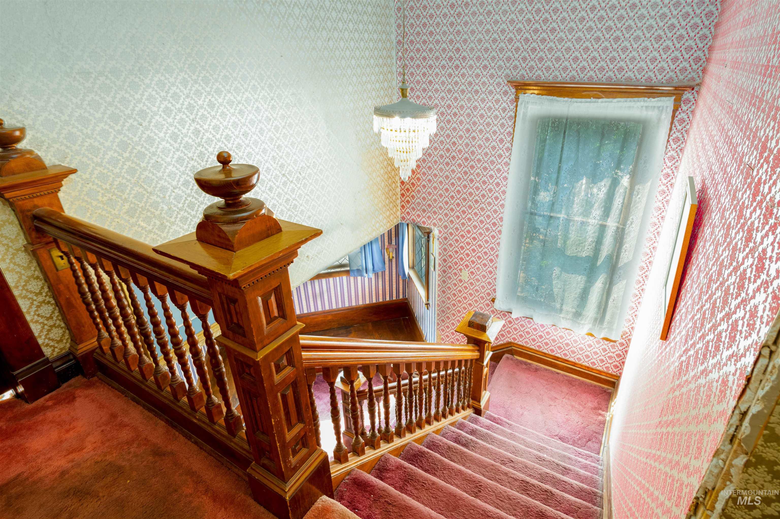 507 7th Avenue Lewiston, ID 83501 - Photo 20 of 30 Staircase featuring wallpapered walls and carpet flooring