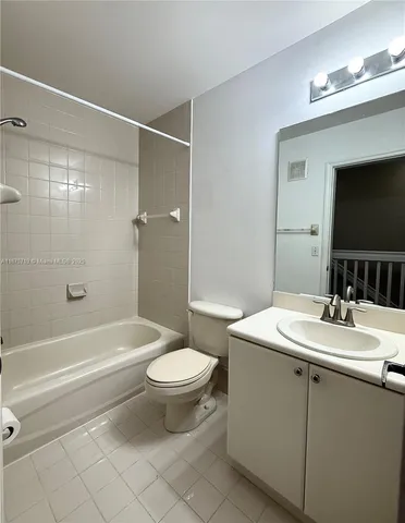 a bathroom with a sink toilet a mirror and shower