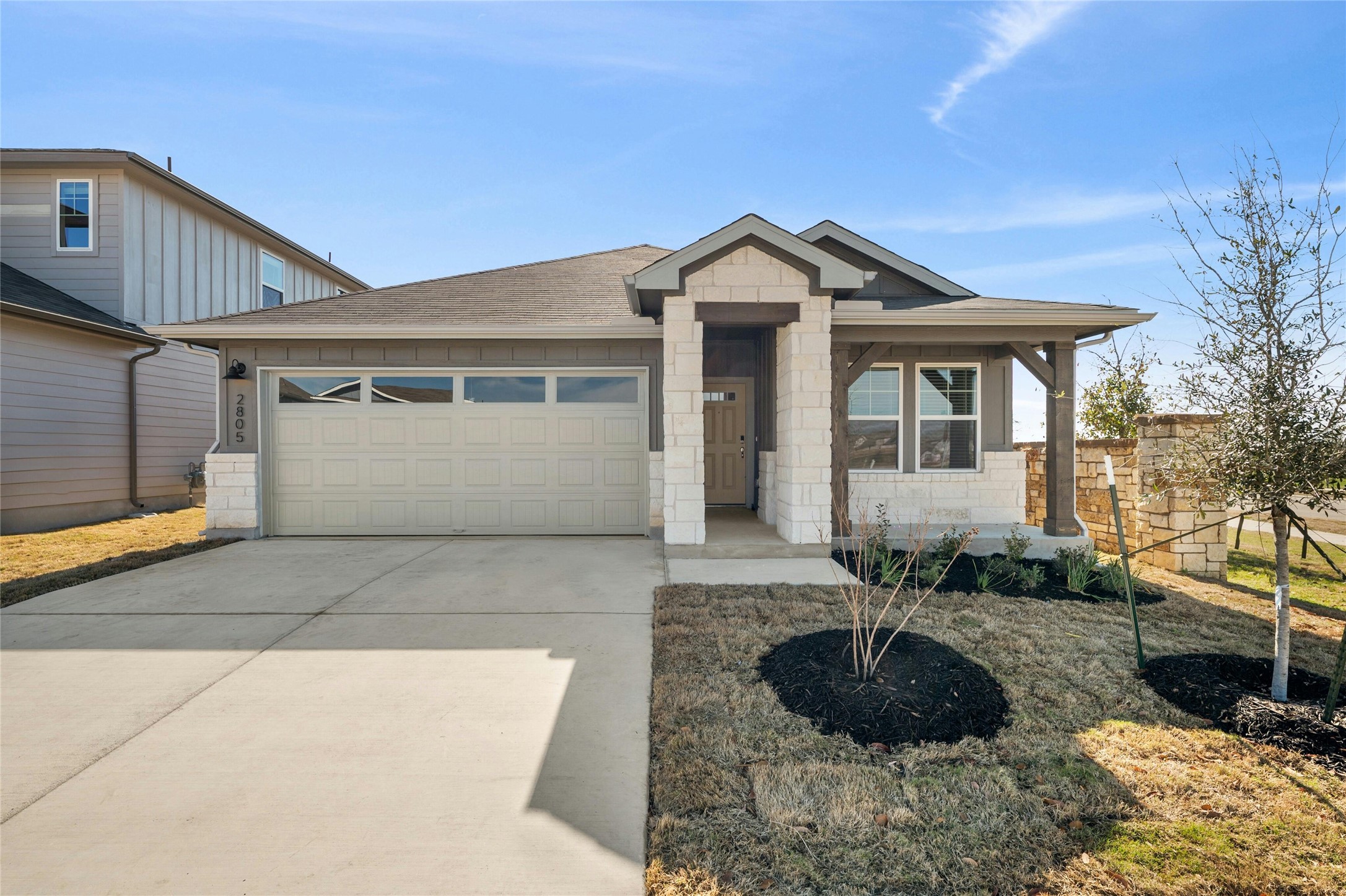 2805 Moyer Lane Round Rock, TX 78665 - Photo 2 of 25 a front view of a house with a yard and garage