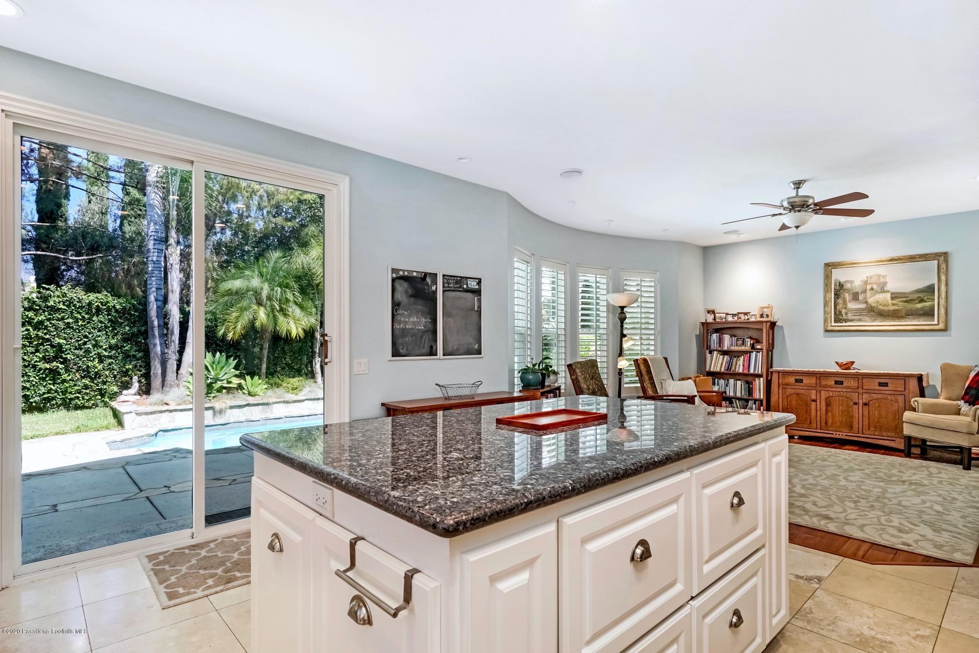 3663 Giddings Ranch Road Altadena, CA 91001 - Photo 14 of 50 a kitchen with granite countertop a sink and a large window