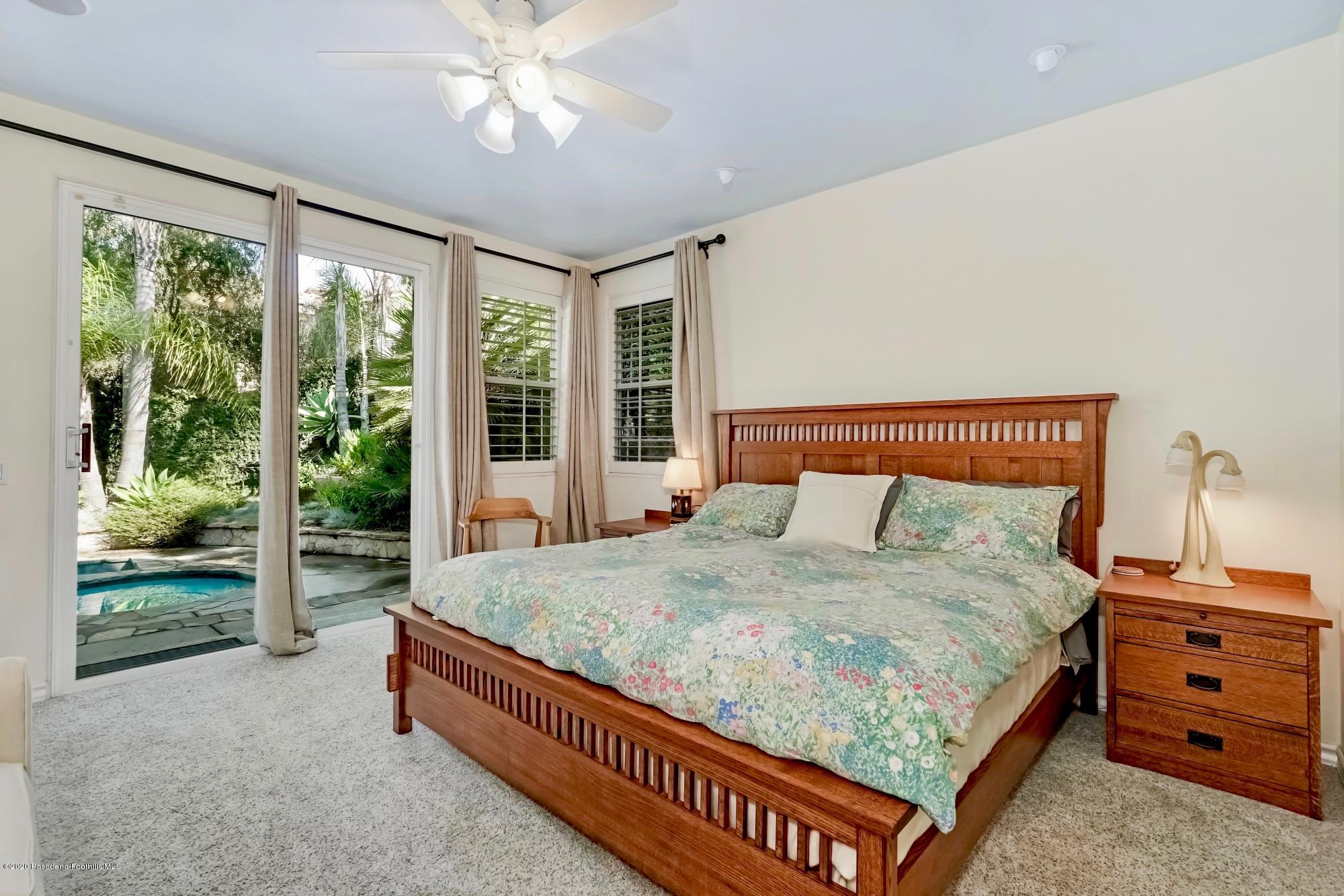 3663 Giddings Ranch Road Altadena, CA 91001 - Photo 22 of 50 a bed sitting in a spacious bedroom next to a window