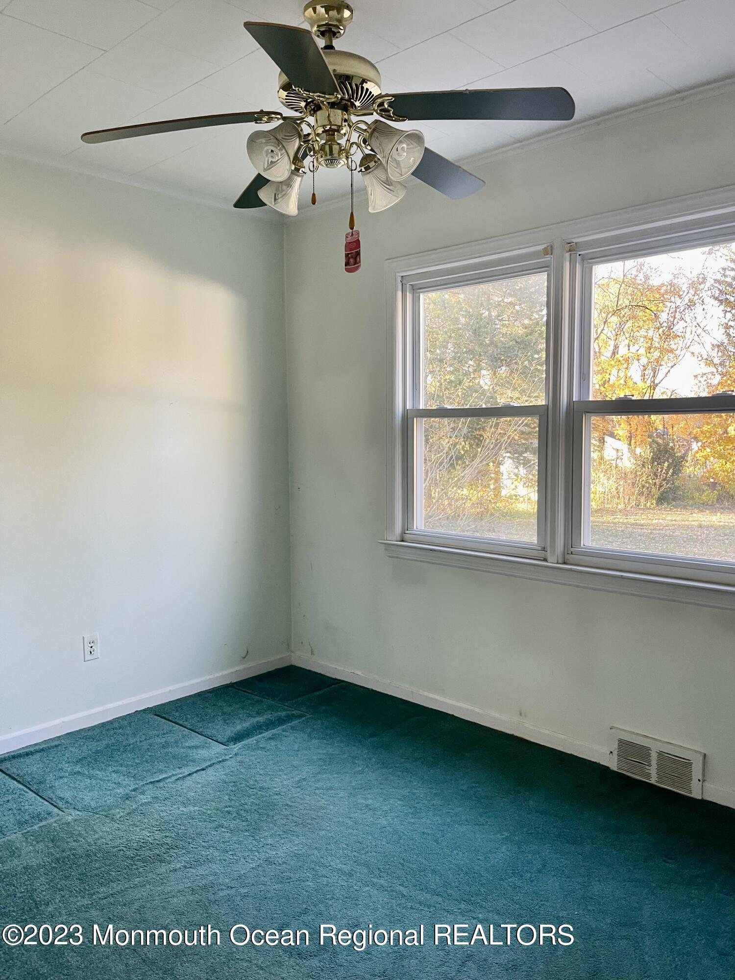 53 Crestview Drive Middletown, NJ 07748 - Photo 20 of 21 a view of an empty room with a window