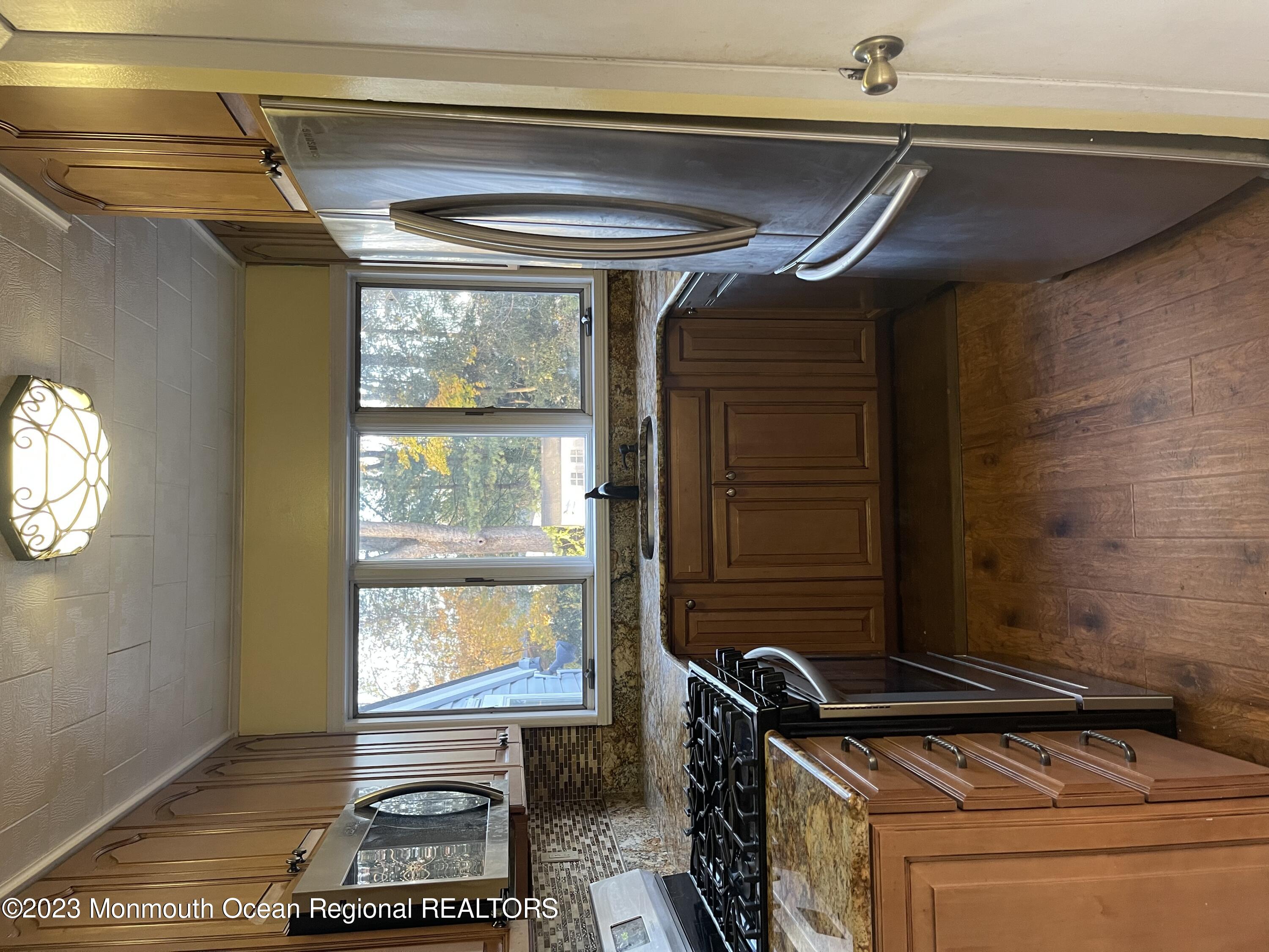 53 Crestview Drive Middletown, NJ 07748 - Photo 4 of 21 a room with furniture and a window