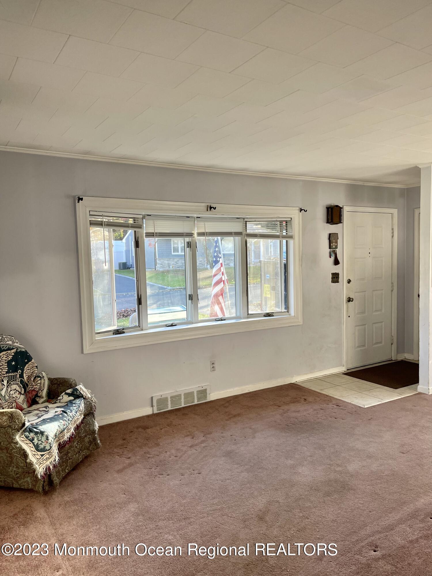 53 Crestview Drive Middletown, NJ 07748 - Photo 9 of 21 a view of an empty room with a window