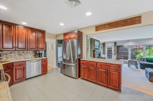 a kitchen with sink and refrigerator