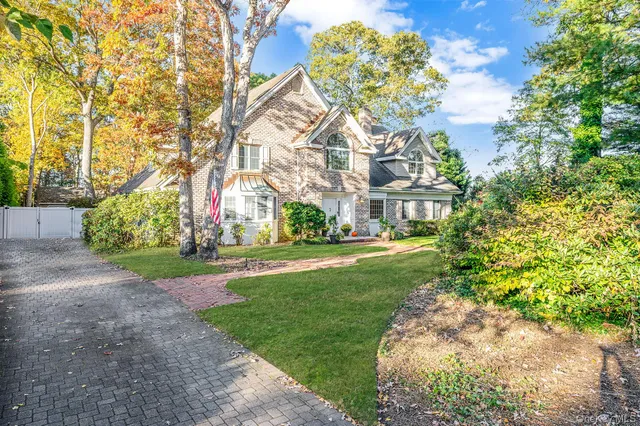 a view of yard with large trees