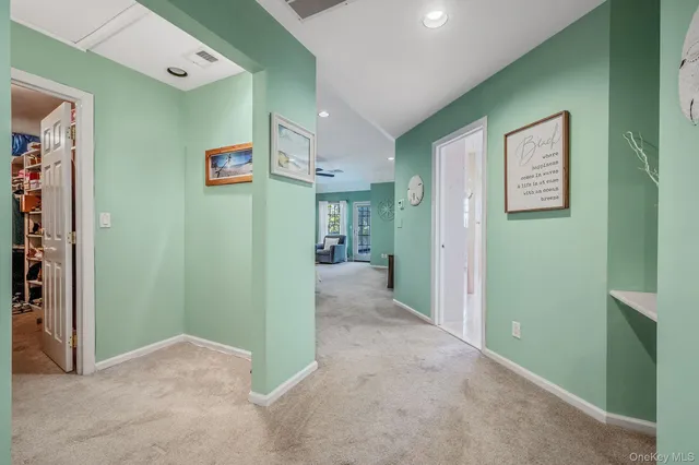 an empty room with closet and a bathroom