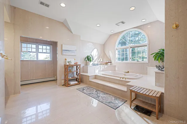 a view of a room with window and hardwood floor
