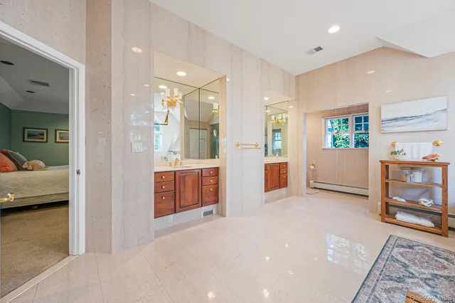 a view of an empty room and a bedroom