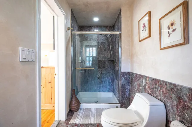 a bathroom with a tub toilet and sink