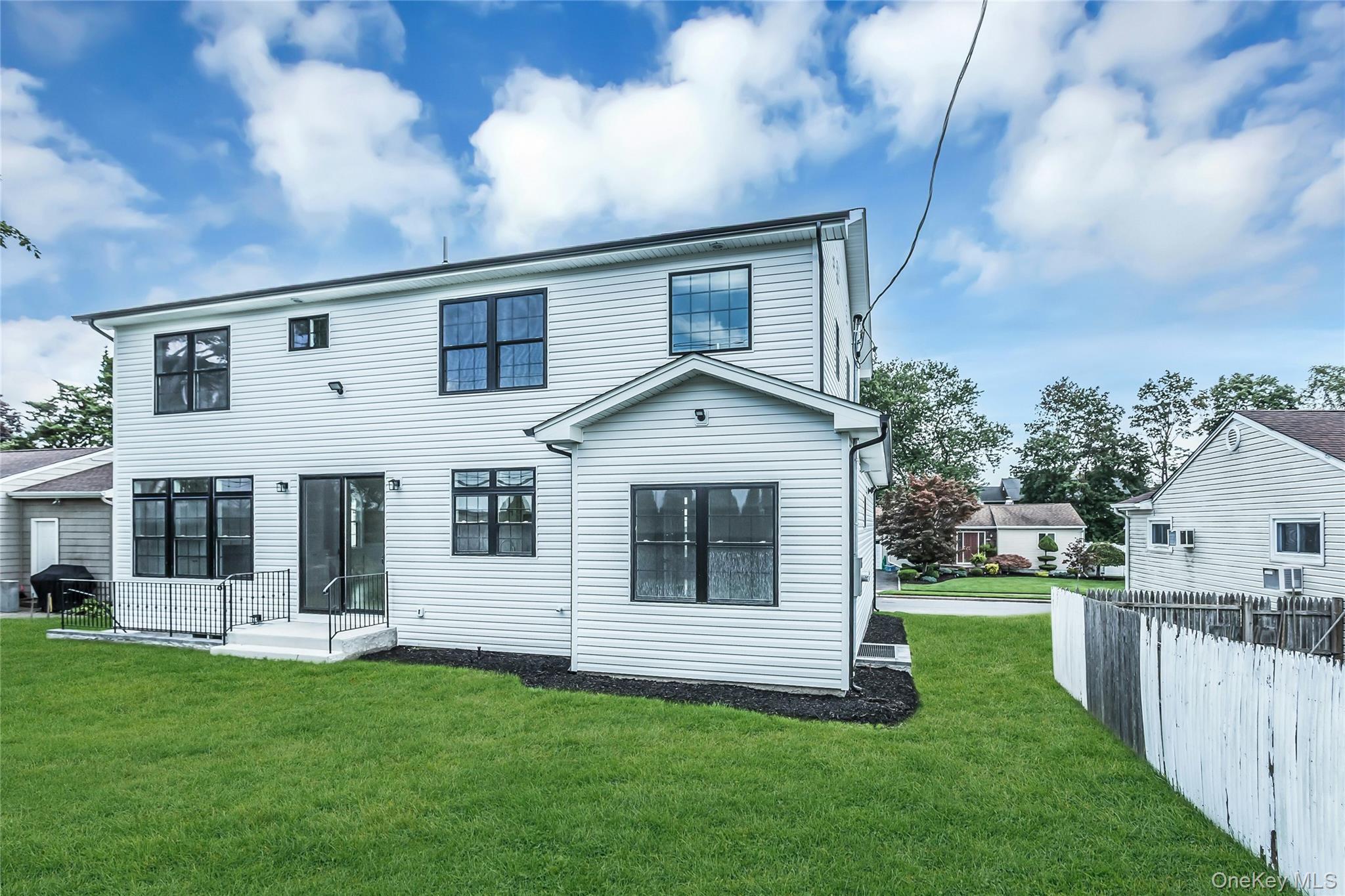 8 Sebree Place Plainview, NY 11803 - Photo 24 of 26 Rear view of house