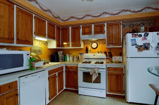 2084 Sutherland Place Hoffman Estates, IL 60169 - Photo 2 of 9 a kitchen with stainless steel appliances granite countertop a stove and a sink