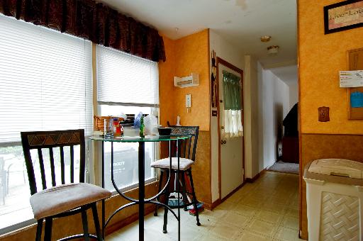 2084 Sutherland Place Hoffman Estates, IL 60169 - Photo 3 of 9 a view of a hallway with furniture and a window