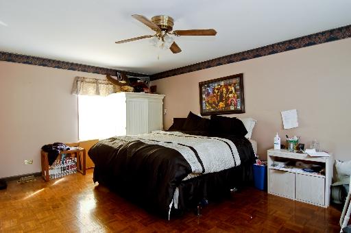 2084 Sutherland Place Hoffman Estates, IL 60169 - Photo 8 of 9 a bedroom with bed and window