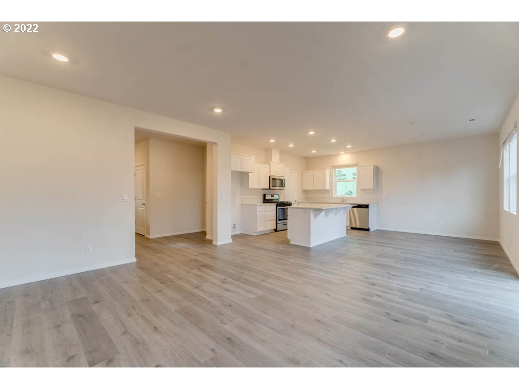 2684 26th Loop Springfield, OR 97477 - Photo 21 of 23 a view of a kitchen with a sink and wooden floor