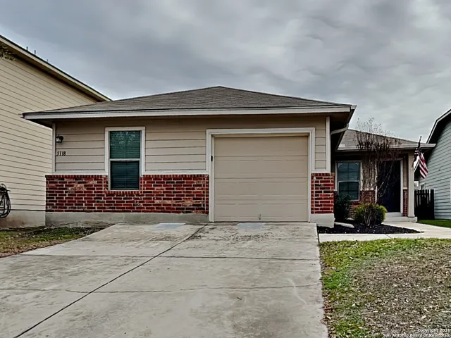 a front view of a house with a garage