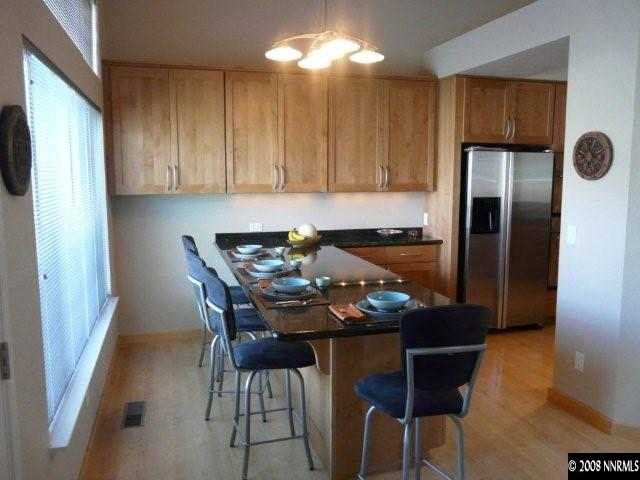 6245 Alpine Meadows Road Reno, NV 89519 - Photo 3 of 7 a view of a dining room with furniture and chandelier