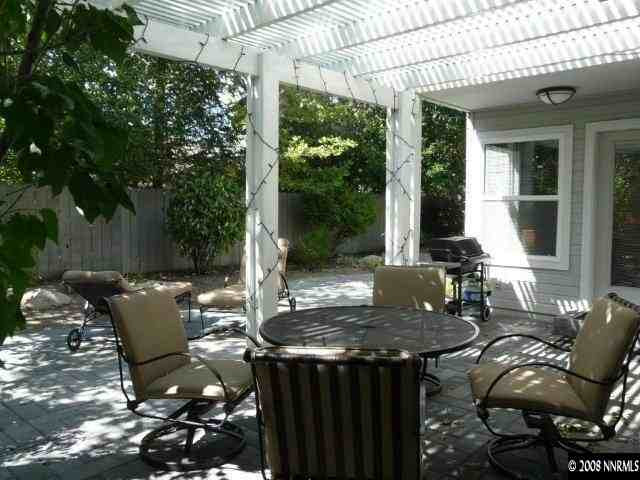6245 Alpine Meadows Road Reno, NV 89519 - Photo 7 of 7 a view of a patio with table and chairs and potted plants