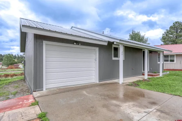 a front view of a house with a garage