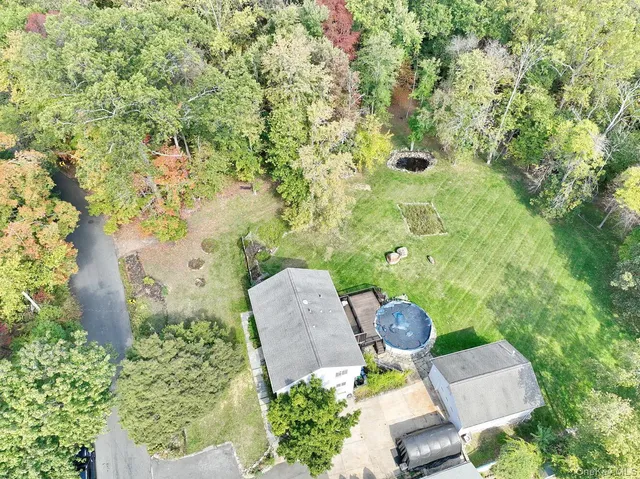 an aerial view of a fireplace with table and chairs