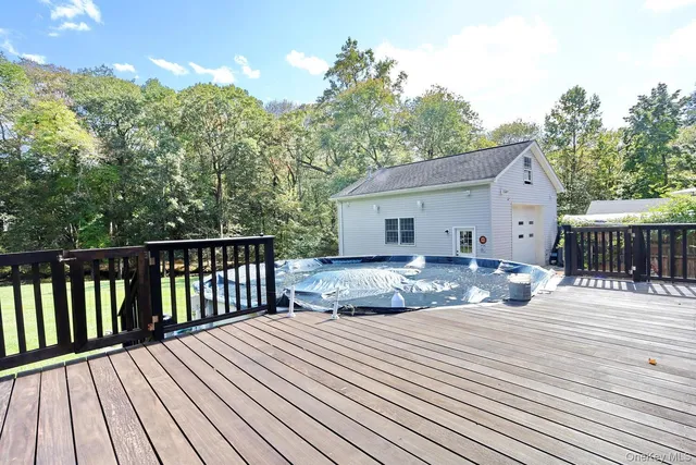 a view of a house with wooden deck