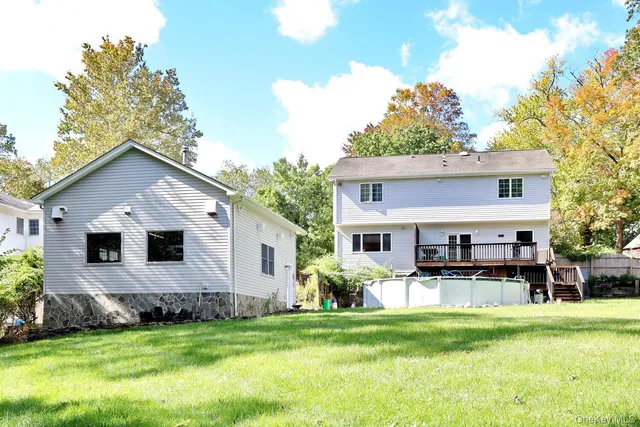 a front view of house with a garden and patio