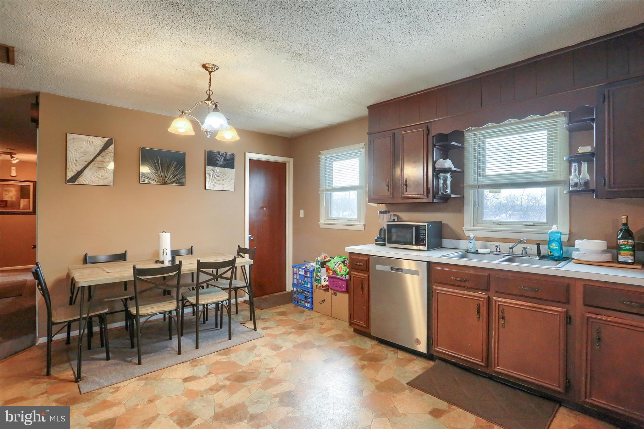 2337 Thornton Road Harrisburg, PA 17109 - Photo 11 of 34 a kitchen with granite countertop stainless steel appliances a sink table and chairs