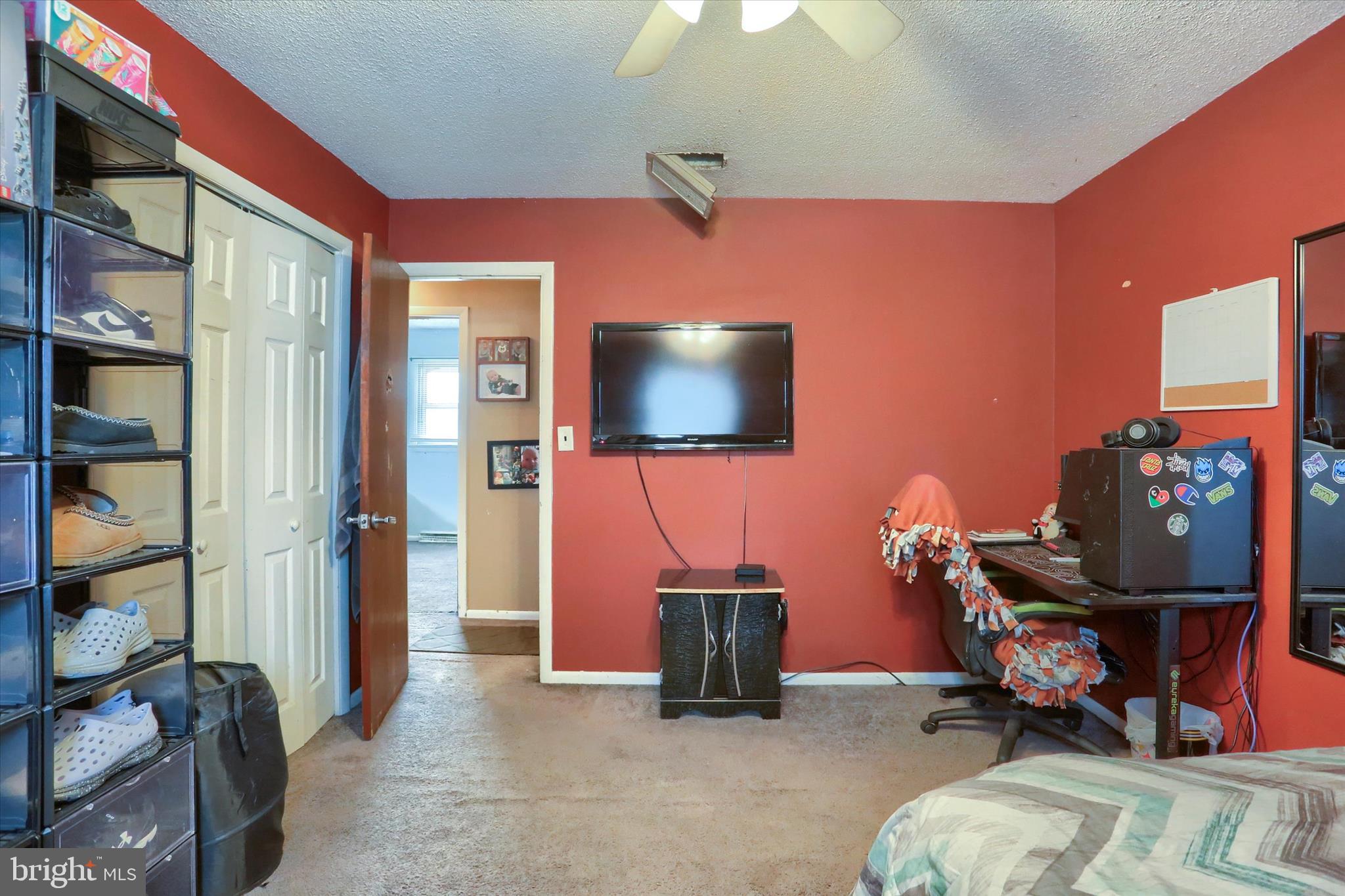 2337 Thornton Road Harrisburg, PA 17109 - Photo 15 of 34 a living room with furniture a flat screen tv and gym equipment