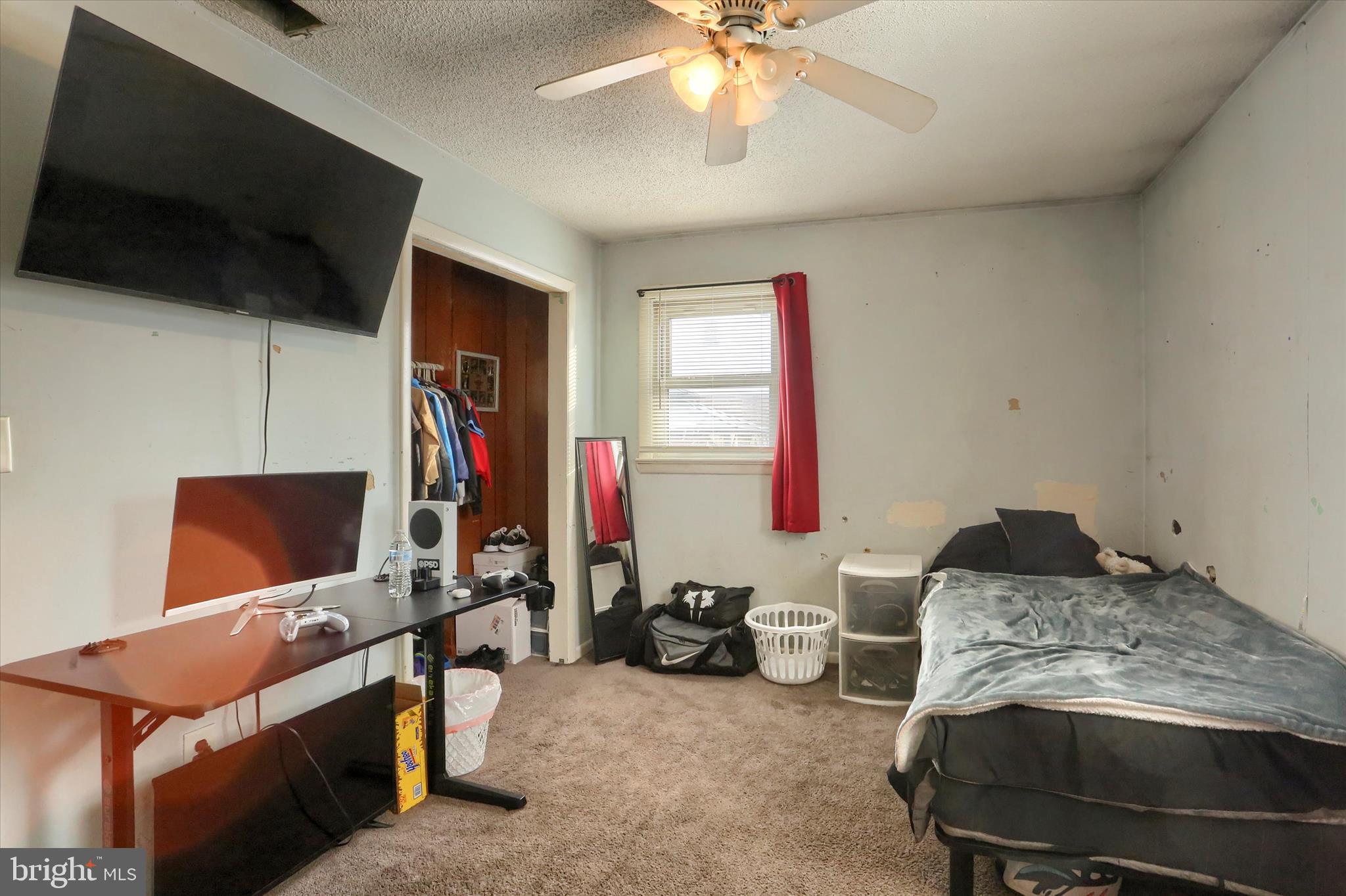 2337 Thornton Road Harrisburg, PA 17109 - Photo 18 of 34 a bedroom with furniture and a flat screen tv
