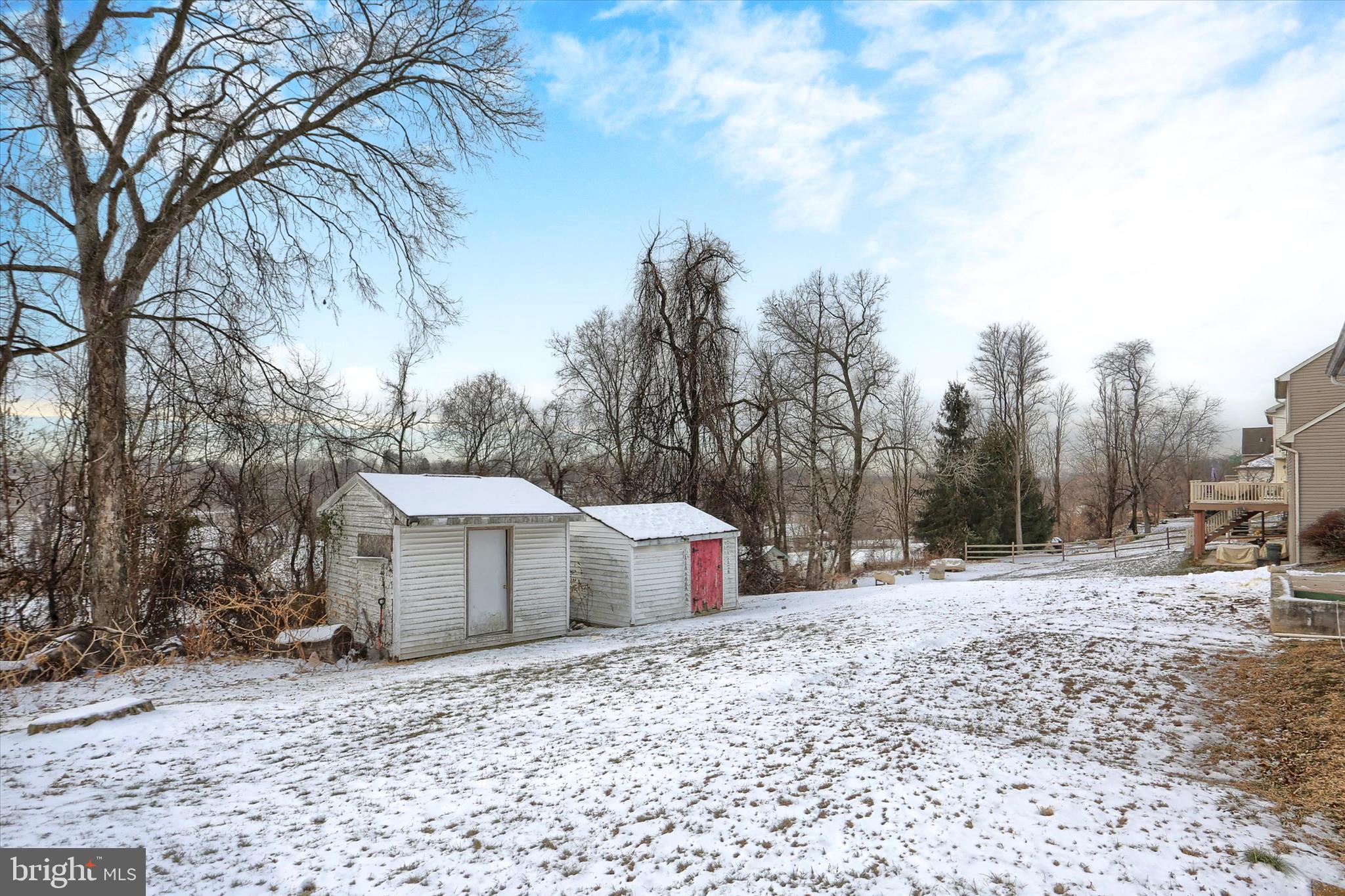 2337 Thornton Road Harrisburg, PA 17109 - Photo 29 of 34 a backyard of a house with trees and covered with snow