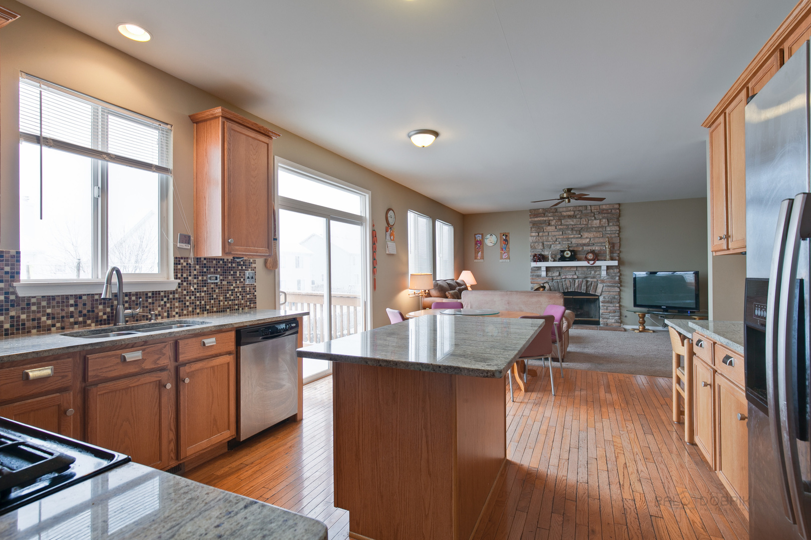 253 West Biros Lane Round Lake, IL 60073 - Photo 14 of 36 a kitchen with stainless steel appliances granite countertop sink stove top oven and cabinets