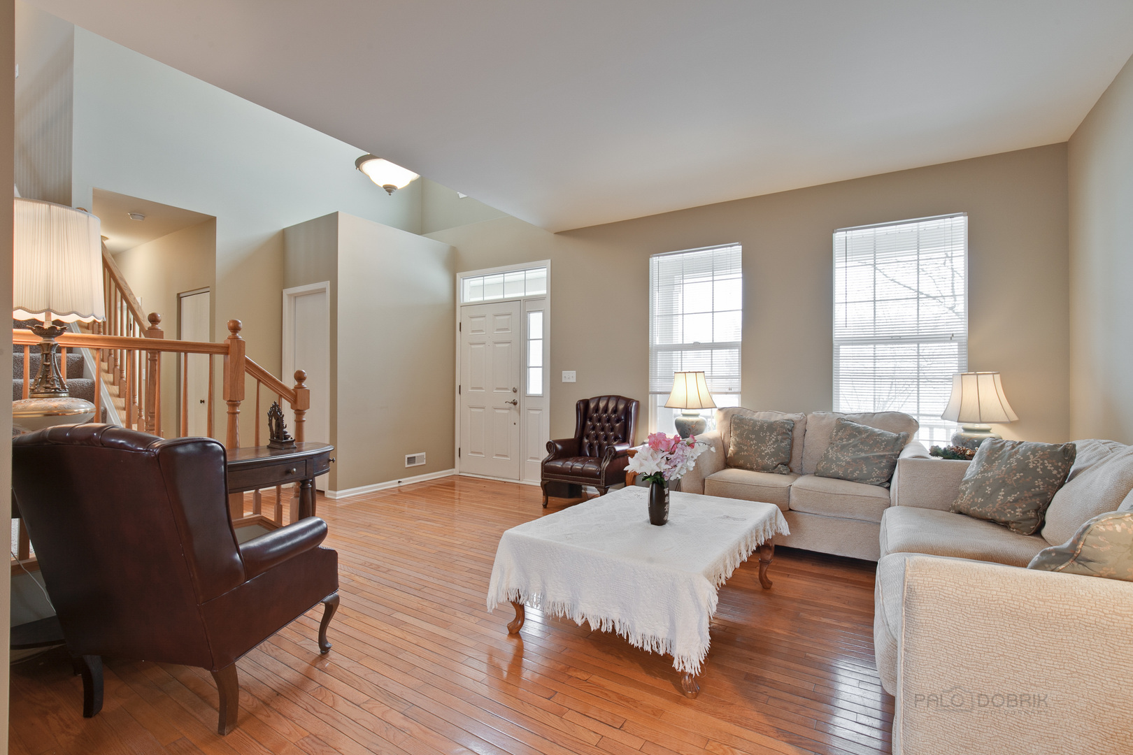 253 West Biros Lane Round Lake, IL 60073 - Photo 3 of 36 a living room with furniture and a wooden floor