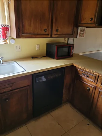 a kitchen with a cabinets and an oven