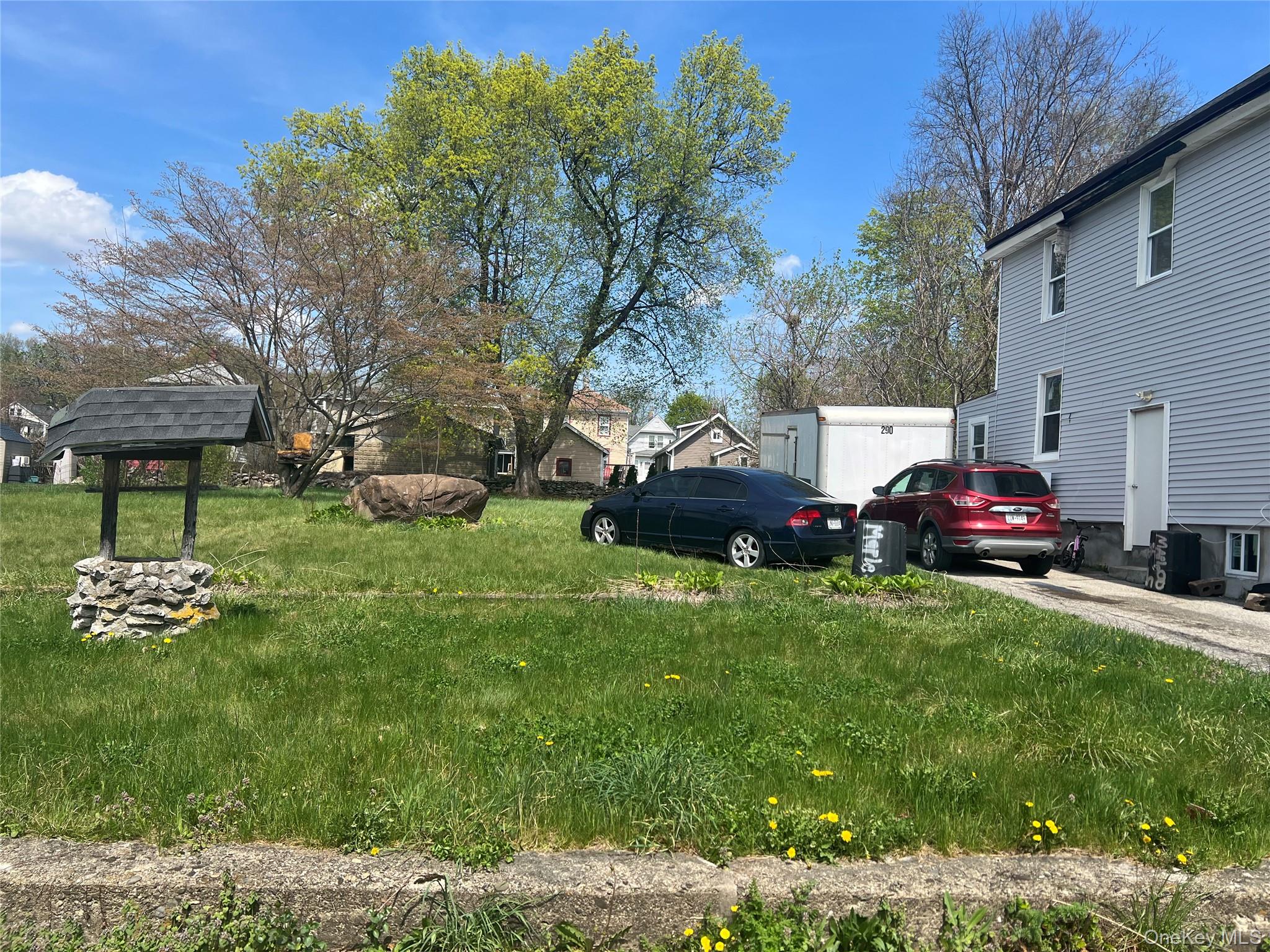 88 Maple Street Newburgh, NY 12550 - Photo 2 of 4 a front view of a house with garden