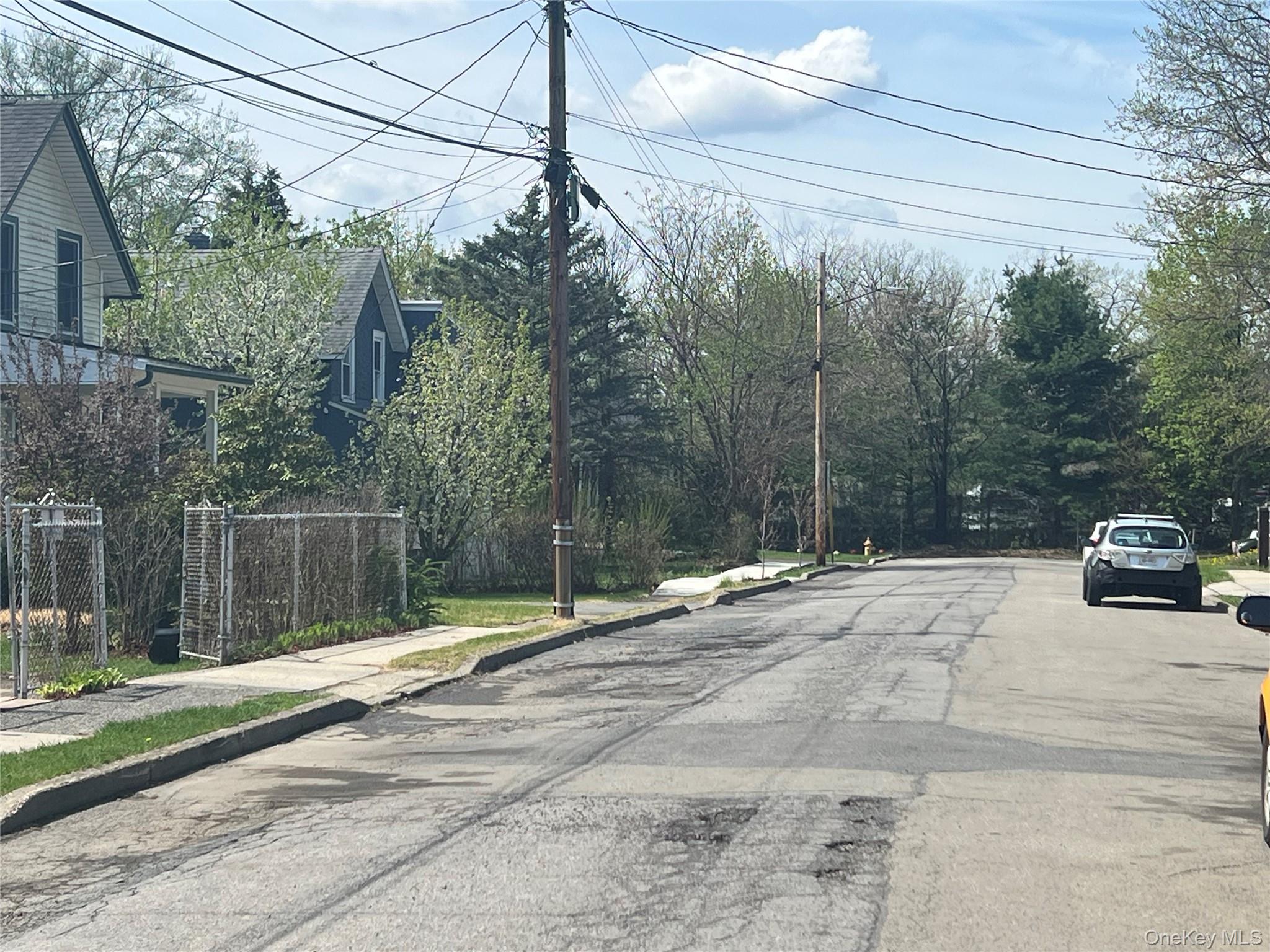 88 Maple Street Newburgh, NY 12550 - Photo 4 of 4 a view of a street with a car park side of the road