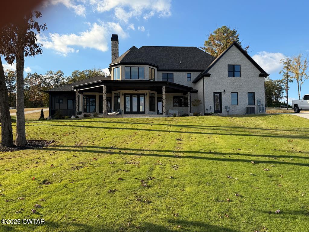 425 Shoreview Lane Huntingdon, TN 38344 - Photo 12 of 65 a front view of a house with a garden