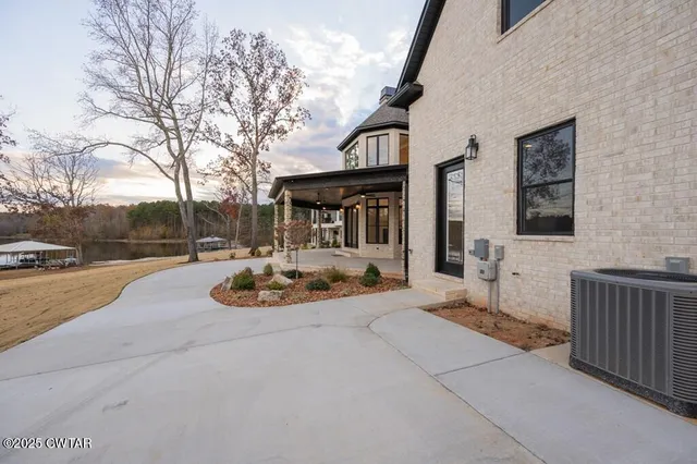 a view of a lake with couches and city view