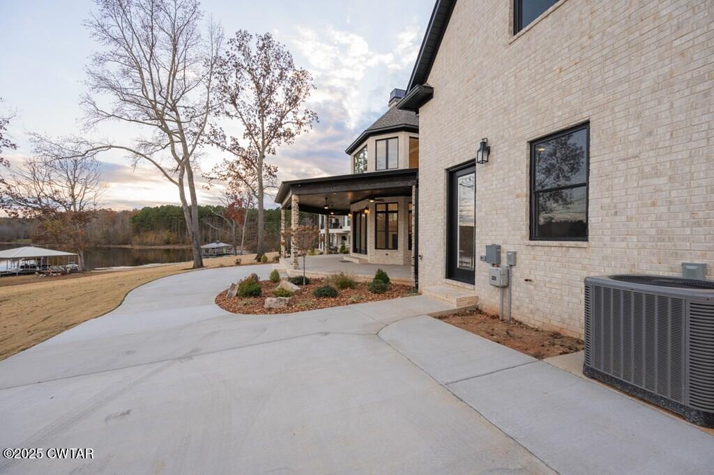 425 Shoreview Lane Huntingdon, TN 38344 - Photo 16 of 65 a view of a house with backyard and sitting area