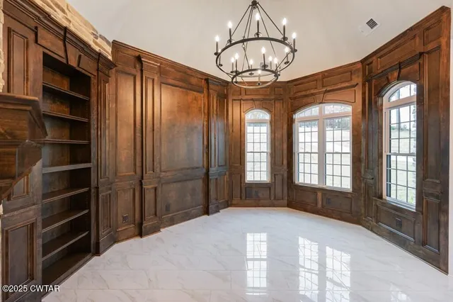 a kitchen with granite countertop a sink stove and cabinets
