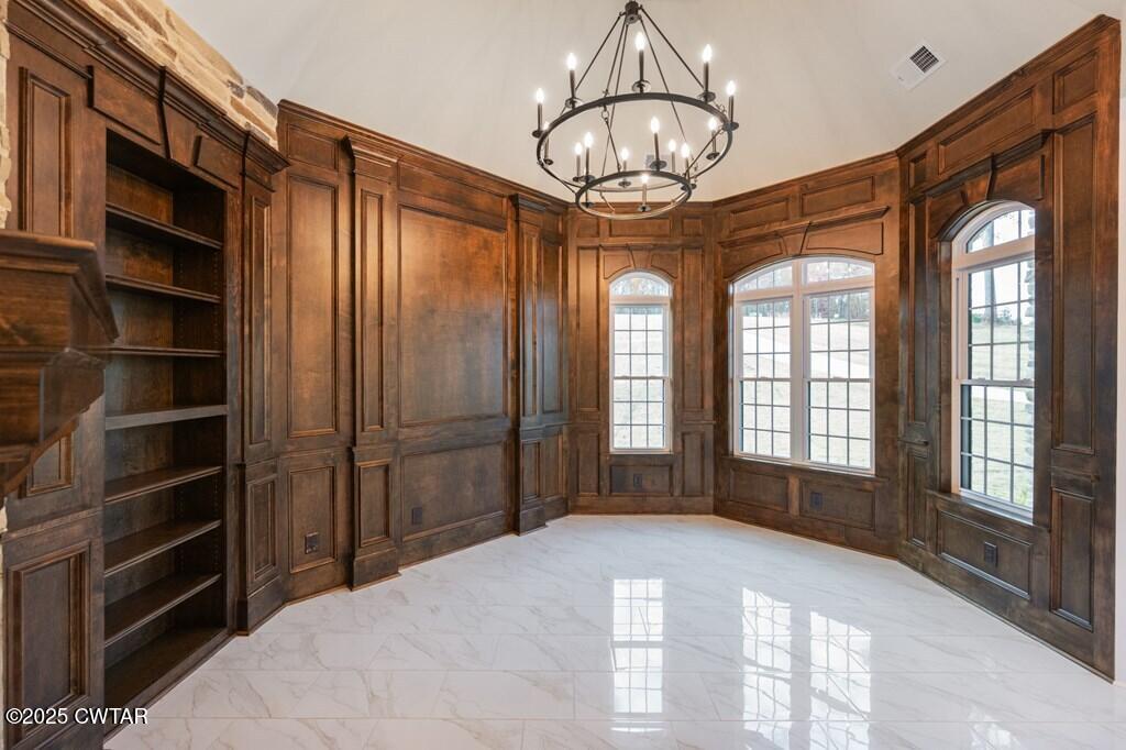 425 Shoreview Lane Huntingdon, TN 38344 - Photo 29 of 65 a view of empty room with a large window and chandelier