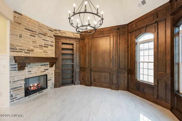 a kitchen with granite countertop a sink stove and cabinets