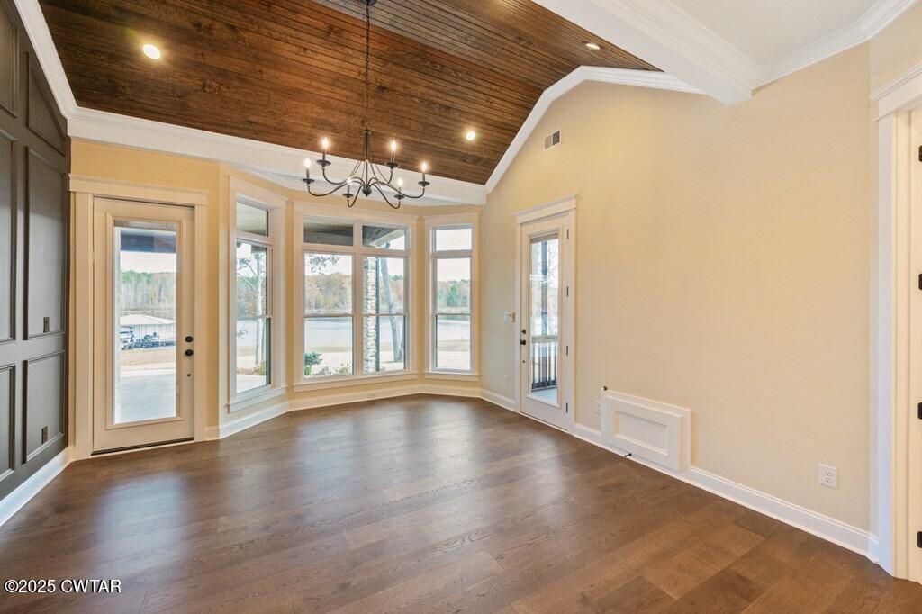 425 Shoreview Lane Huntingdon, TN 38344 - Photo 41 of 65 a view of an empty room with wooden floor and a window