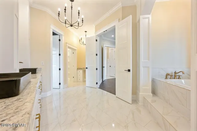 a view of a chandelier in an empty room