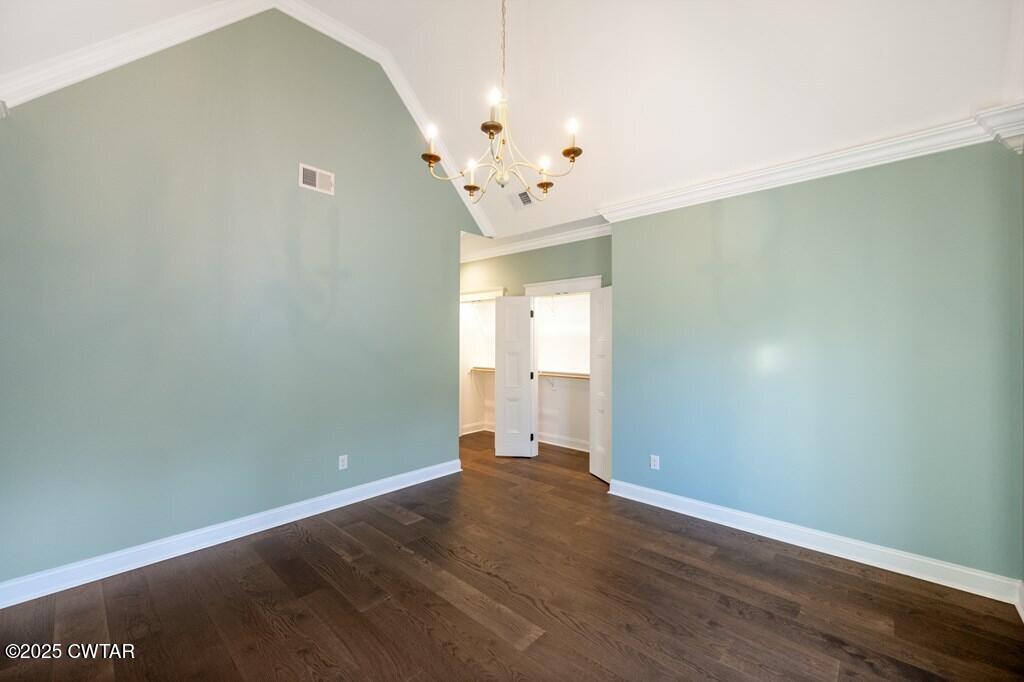 425 Shoreview Lane Huntingdon, TN 38344 - Photo 55 of 65 an empty room with wooden floor and windows