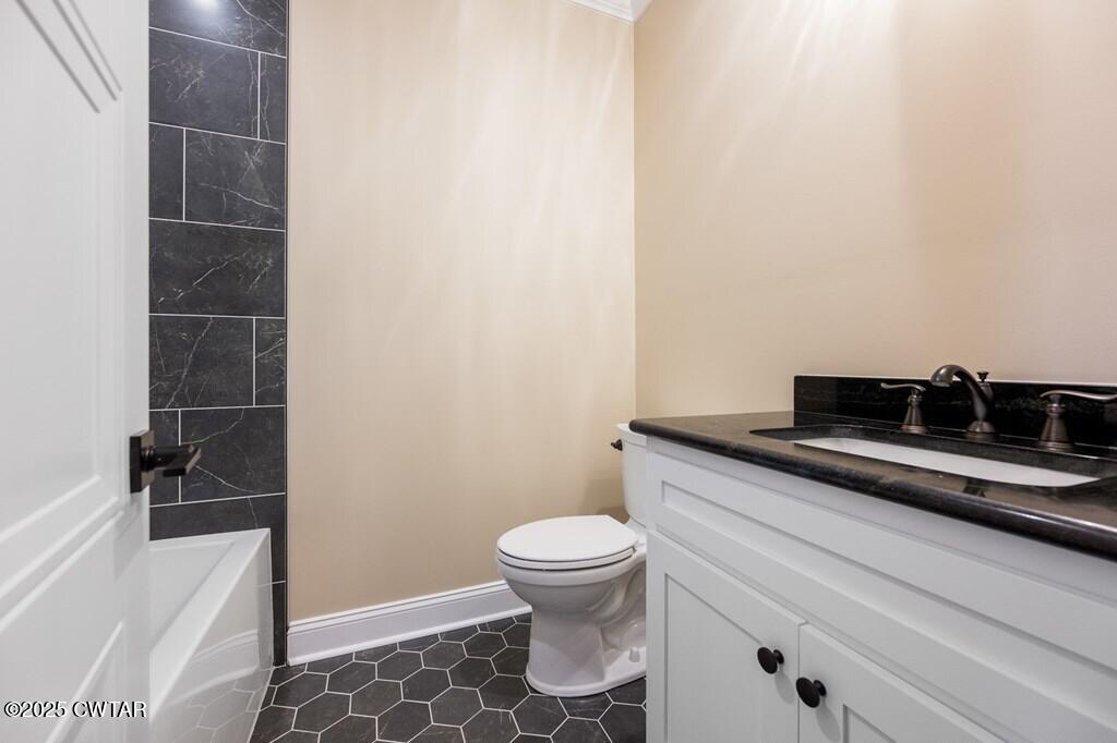 425 Shoreview Lane Huntingdon, TN 38344 - Photo 61 of 65 a bathroom with a granite countertop sink toilet and shower