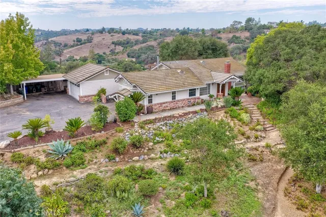an aerial view of a house with a garden
