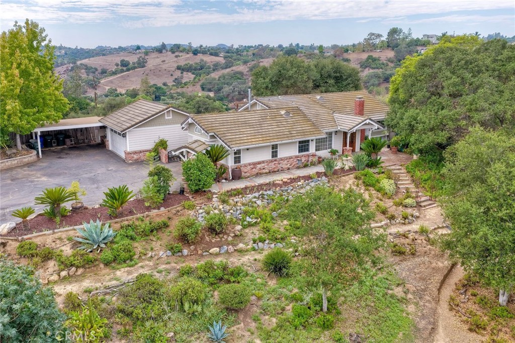 an aerial view of a house with a garden