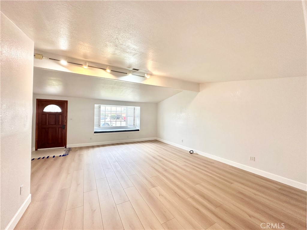 14132 Roxanne Drive Westminster, CA 92683 - Photo 15 of 36 an empty room with windows and cabinet