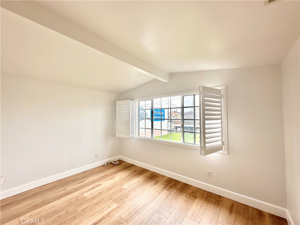 14132 Roxanne Drive Westminster, CA 92683 - Photo 17 of 36 an empty room with wooden floor and windows