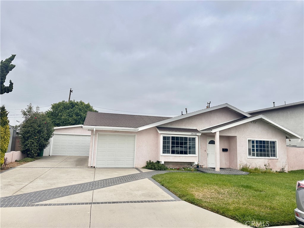 14132 Roxanne Drive Westminster, CA 92683 - Photo 2 of 36 front view of a house with a yard and a garage
